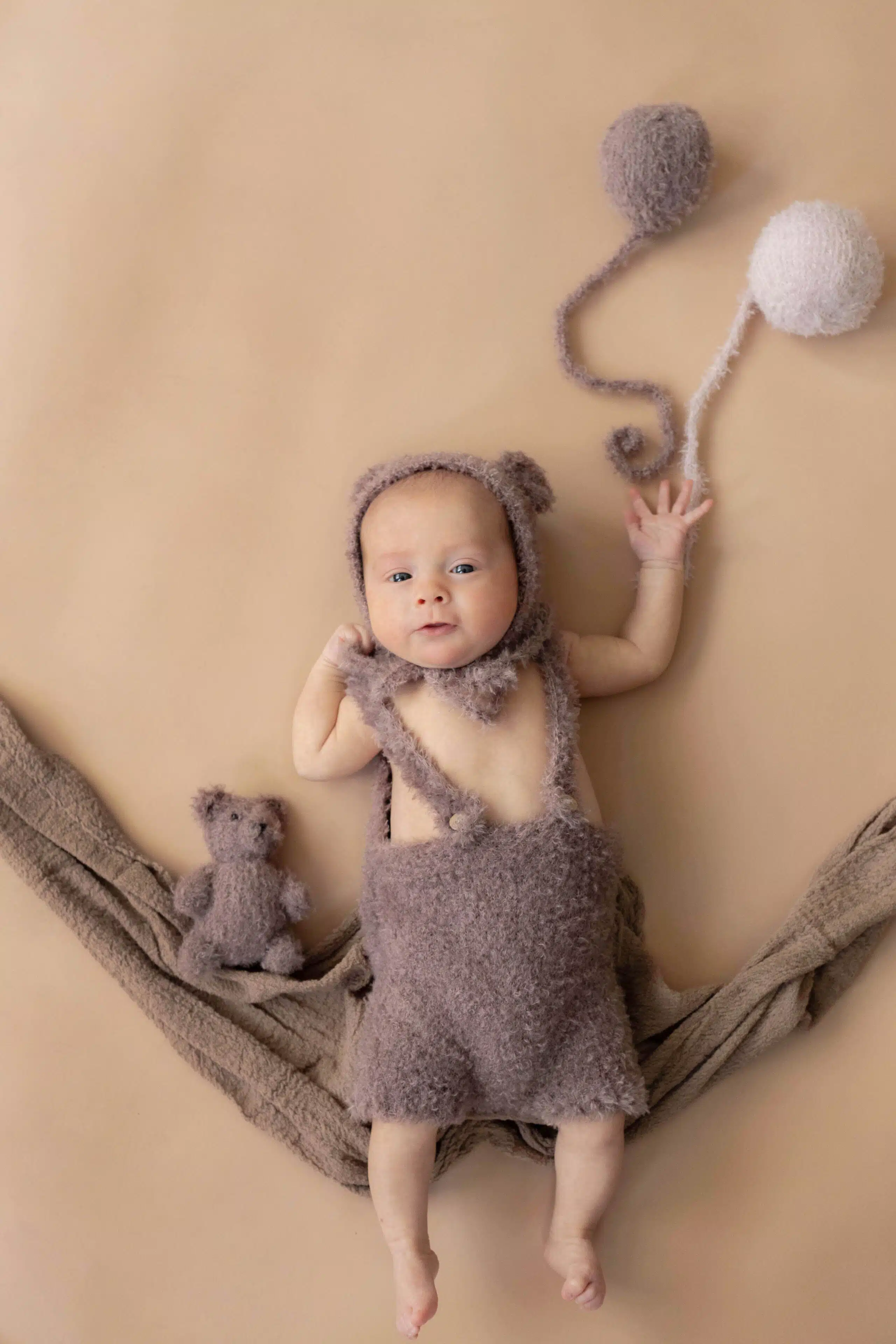 newborn photo of baby with balloons